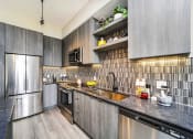 Thumbnail 15 of 23 - Well Equipped Kitchen at Quantum Apartments, Fort Lauderdale, FL