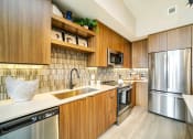 Thumbnail 17 of 23 - Fully Equipped Kitchen at Quantum Apartments, Fort Lauderdale