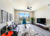 Thumbnail 14 of 23 - Living Room With TV at Quantum Apartments, Fort Lauderdale, Florida