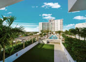 Thumbnail 2 of 23 - The Bridge pool deck and North Tower at Quantum Apartments