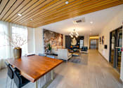 Thumbnail 15 of 72 - A modern dining room with a wooden table and chairs.
