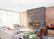 Thumbnail 7 of 72 - A modern living room with a fireplace and comfortable seating.