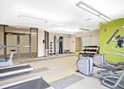 Thumbnail 33 of 72 - A gym with treadmills, elliptical machines and other exercise equipment.