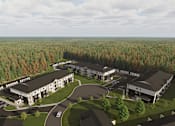 Thumbnail 1 of 20 - A large building complex surrounded by trees.