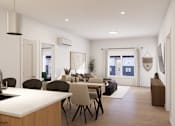 Thumbnail 7 of 20 - A modern kitchen with a dining table and chairs.
