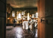 Thumbnail 2 of 12 - A kitchen with a table and a table cloth on it