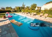 Thumbnail 8 of 12 - Community pool with lounge furniture and pool toys