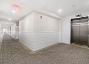 Thumbnail 7 of 17 - Elevator Lobby and Hallway