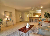 Thumbnail 16 of 41 - a living room with a couch and a table