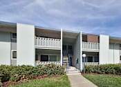 Thumbnail 10 of 20 - A white building with a blue sky in the background.