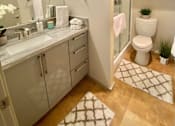 Thumbnail 10 of 31 - a bathroom with a sink toilet and a shower