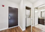 Thumbnail 19 of 45 - A black door with a silver handle is on the left.
