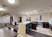 Thumbnail 13 of 25 - A modern kitchen and dining area in a commercial space.