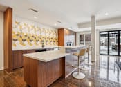 Thumbnail 34 of 42 - Community Kitchen with white island at Arcata Apartments, Minnesota, 55416