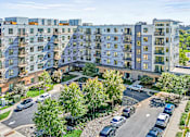 Thumbnail 24 of 33 - an aerial view of an apartment building on a city street