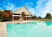 Thumbnail 17 of 26 - A house with a pool in front of it.