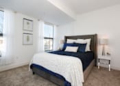 Thumbnail 3 of 21 - a bedroom with a large bed and two windows