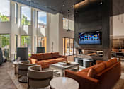 Thumbnail 1 of 40 - a living room filled with furniture and a flat screen tv