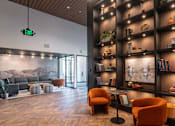 Thumbnail 32 of 40 - a view of the lobby with a large bookshelf in the background