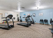 Thumbnail 13 of 24 - our gym has plenty of exercise equipment and chairs for residents to use