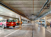 Thumbnail 22 of 24 - an empty parking garage with cars parked in it