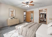 Thumbnail 9 of 24 - a bedroom with a large bed and a ceiling fan