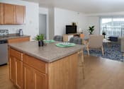Thumbnail 3 of 11 - Kitchen Island and Living Room