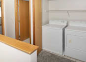Thumbnail 21 of 24 - a small laundry room with a washer and dryer