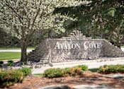 Thumbnail 18 of 24 - a sign for avlon cove on the side of a road