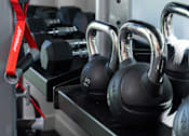 Thumbnail 12 of 24 - a group of headphones on a docking station in a gym