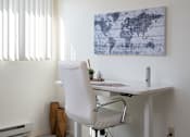 Thumbnail 17 of 28 - a desk with a chair in a home office at The Bosk Apartment Homes, Minnesota 55125