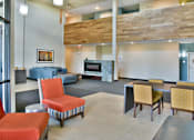 Thumbnail 13 of 24 - Lounge with Tables and Fireplace