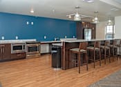Thumbnail 18 of 24 - Community Room Kitchen and Bar