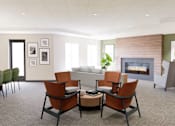 Thumbnail 15 of 26 - A living room with a fireplace and a couch.