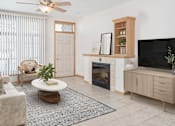Thumbnail 3 of 27 - a living room with a fireplace and a tv