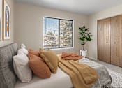 Thumbnail 4 of 13 - a bedroom with a bed with pillows and blankets on it