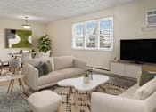 Thumbnail 3 of 13 - a living room with couches and a table and a television