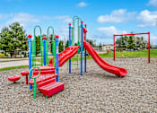 Thumbnail 12 of 13 - a playground with a red slide and monkey bars in a park