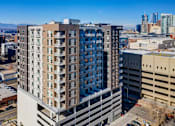 Thumbnail 24 of 24 - Exterior view of Civic Lofts building and parking structure, with view of Denver skyline