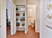 Thumbnail 12 of 30 - All white hallway with extra large closets for storage in between bedroom and private bathroom.
