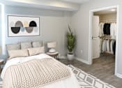 Thumbnail 4 of 30 - A bedroom with a large bed and a painting on the wall.