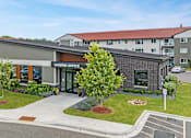 Thumbnail 29 of 30 - a view of the leasing office from the parking lot