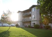 Thumbnail 7 of 10 - Exterior of Cottonwood Apartment Homes with spacious balconies and patios.