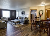 Thumbnail 6 of 10 - a living room and dining room with furniture and a table