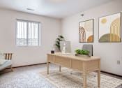 Thumbnail 5 of 18 - an office with a desk and a chair and a window
