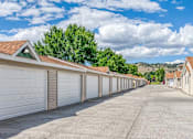 Thumbnail 17 of 18 - a long row of garages with white garage doors