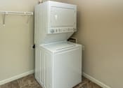 Thumbnail 8 of 21 - an empty laundry room with a washer and dryer