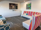 Thumbnail 17 of 21 - a living room with couches and a television