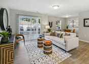 Thumbnail 3 of 26 - an open living room with a white couch and a rug