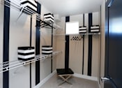 Thumbnail 8 of 25 - Spacious Walk in Closet